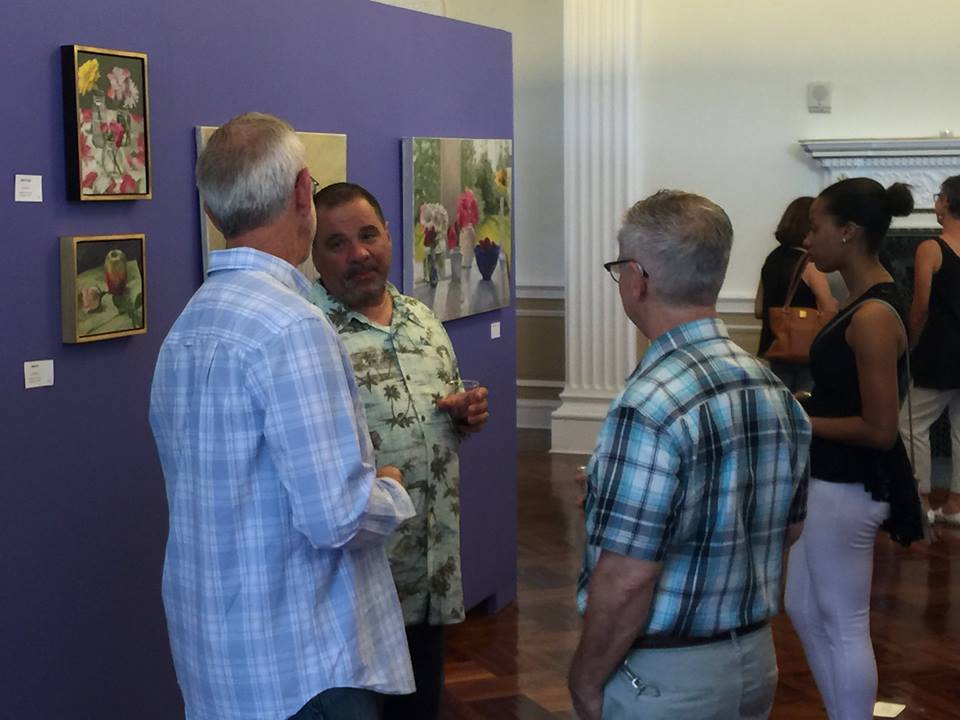 Anthony Casasanto (right) in rapt conversation with visitors.